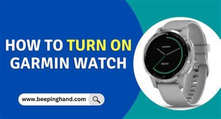 How do you turn on a Garmin watch?